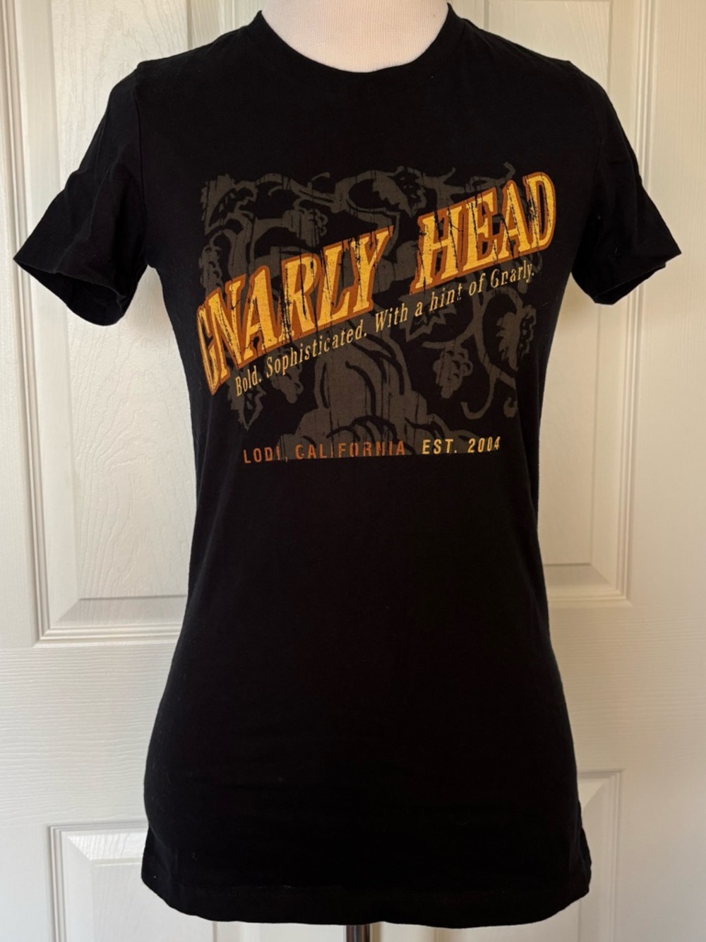 Abella Black Tee with Orange-Gold 'Gnarly Head' Graphic